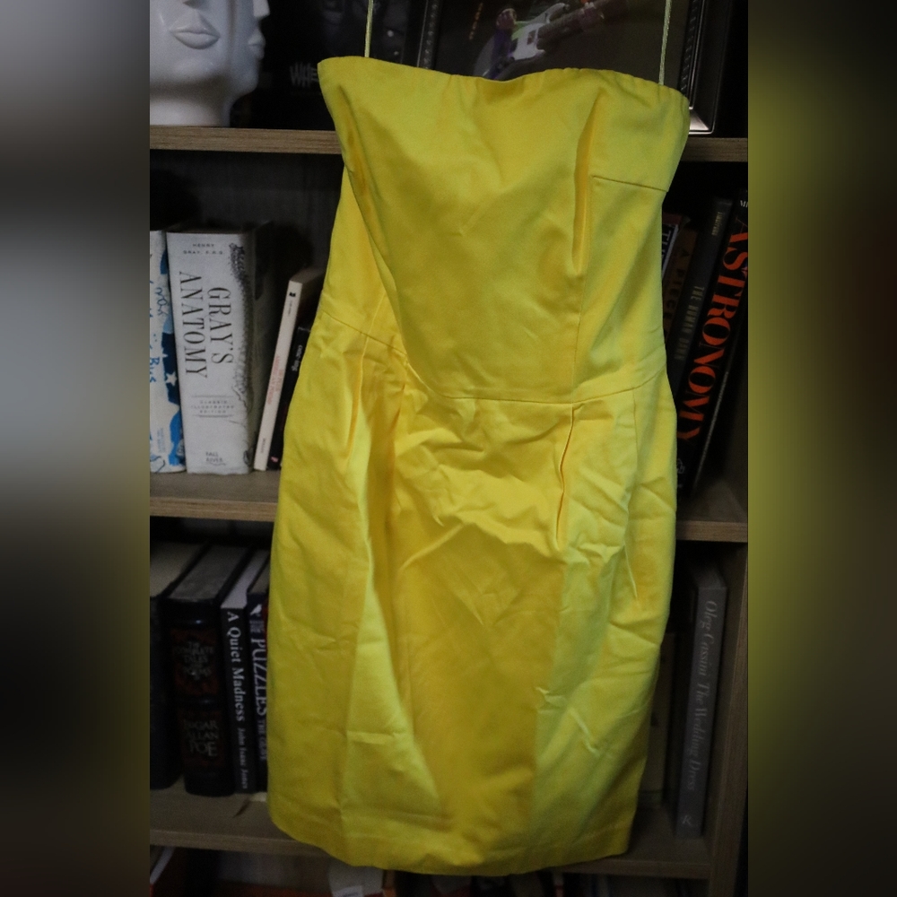 Bright yellow strapless sheath dress